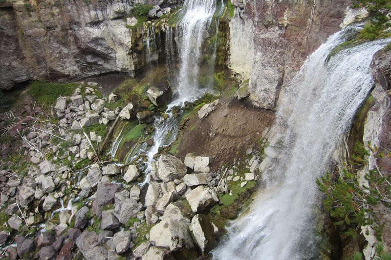 Twin cascades of Paulina Falls seen from above the rocky gorge