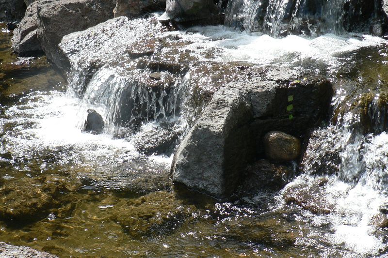 Small waterfall tumbling over boulders at the Sunriver Lodge